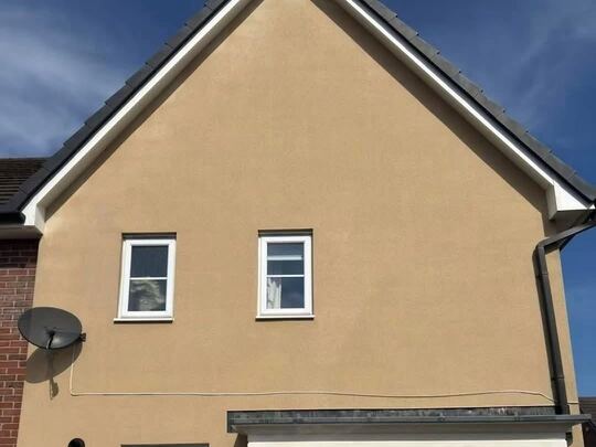 After: rendered house wall